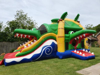 Crocodile Multiplay Bouncer with Slide, a bounce and slide combo for hire from Crockerz Castles