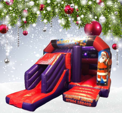 Christmas castle with slide, a bounce and slide combo for hire from Jumping Jacks Bouncy Castles
