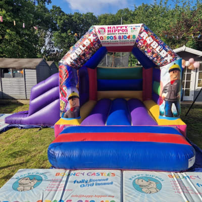 Roblox Slide 15ft x 18ft - Purple & Red, a inflatable slide for hire from Happy Hippos Bouncy Castles