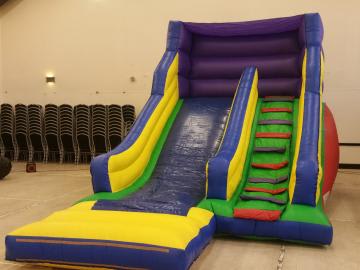 Colourful Slide, a inflatable slide for hire from Bouncy Castle Club