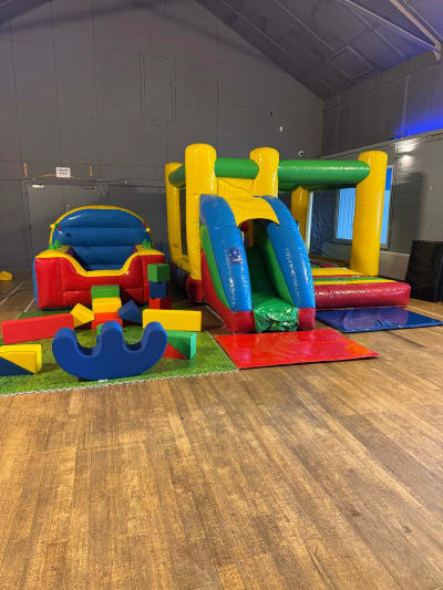 Multi colour bounce and slide with matching soft play and Ball pool, a bounce and slide combo for hire from Bounce House Inflatables