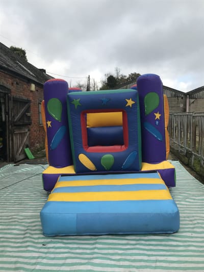 10x10 Toddlers blue and yellow balloons and stars bouncy castle, a bouncy castle for hire from Wallington Bouncy Castles