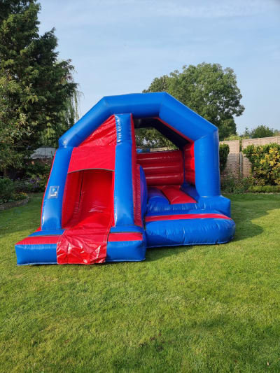 Red & Blue bouncy castle slide combo, a bounce and slide combo for hire from Bouncy Boss