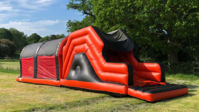 50ft Adult Assault Course, a assault course for hire from Animal Bouncers