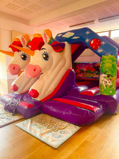 Twin Unicorn Bounce N Slide, a bounce and slide combo for hire from Bouncy Mania