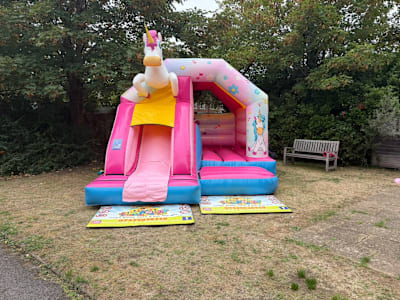 Pink Unicorn Bounce N Slide, a bounce and slide combo for hire from Jump N Joy Inflatables