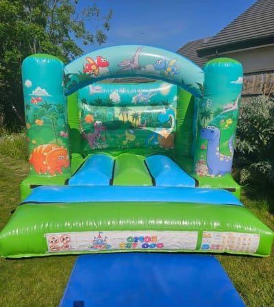 Bouncy Castle Dinosaur themed 10ft x 10ft, a bouncy castle for hire from 1st Choice Inflatables