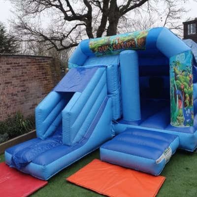 Dinosaur Combo, a bouncy castle for hire from Bounce About Sussex