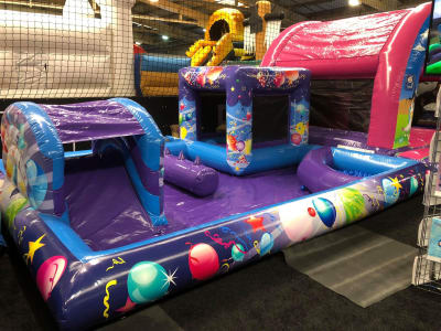 Deluxe Playzone with slide, castle and Ball Pool, a bounce and slide combo for hire from Abc Party Hire