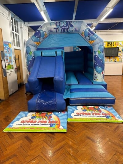 Large Party Time Blue Bouncy Castle, a bouncy castle for hire from Bouncy Castle Fun World
