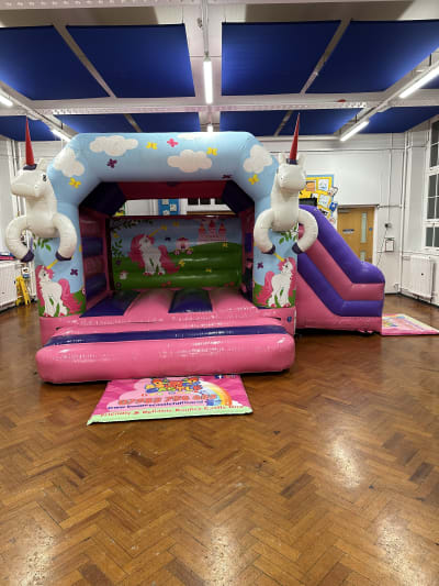 Unicorn Side Slide, a inflatable slide for hire from Bouncy Castle Fun World