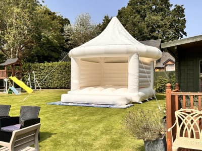 White Wedding Carousel Bouncy Castle, a bouncy castle for hire from Wizard Bouncy Castles