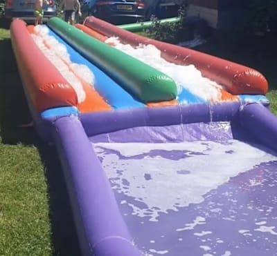 Water Slide Dual Lane Inflatable (Plain) 40ft x 12ft, a inflatable slide for hire from 1st Choice Inflatables