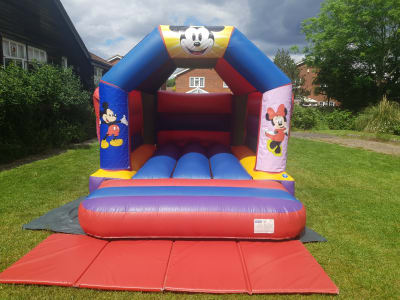 11 x 15 Mickey and Minnie Mouse Bouncy castle, a bouncy castle for hire from TnT PartyTime