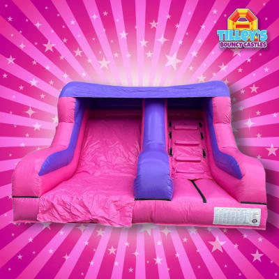 Pretty Pink inflatable slide, a inflatable slide for hire from Tilley's Bouncy Castles and Soft Play Hire