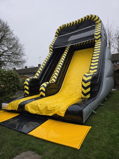 12ft Platform Hazard Super Slide, a inflatable slide for hire from MLM Bouncy Castles