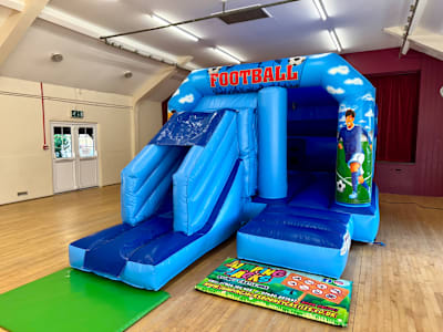 Football blue Velcro with slide, a inflatable slide for hire from Jumping Jacks Bouncy Castles