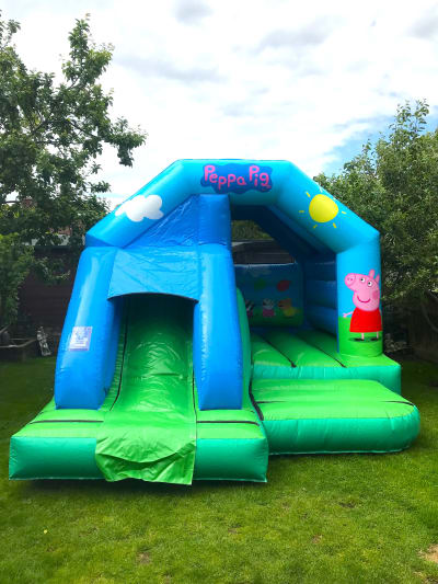 Peppa Pig Front Slide Combi, a bounce and slide combo for hire from Chloe's Castles