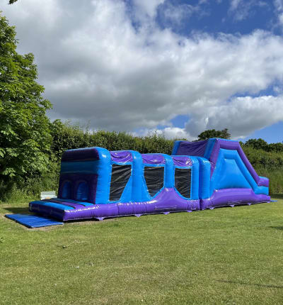 40ft x 10ft Ice blue obstacle course, a assault course for hire from Bounce Mania