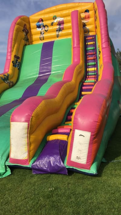 BMX Mega Slide 20ft Platform, a inflatable slide for hire from Animal Bouncers