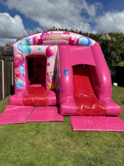 Pink Party Bounce 'n' Slide (12ft x 18ft), a bounce and slide combo for hire from Elmbridge Inflatables