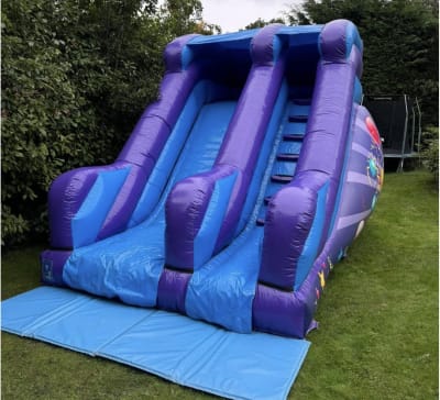 8ft Party Blue/Purple Slide, a inflatable slide for hire from Elmbridge Inflatables