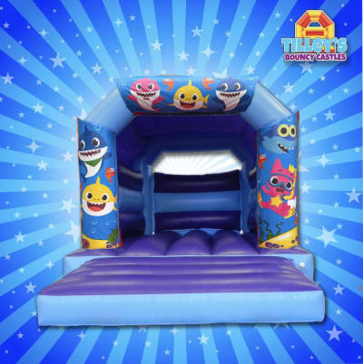Baby Shark Bouncy Castle (Blue & Purple), a toddler inflatable for hire from Tilley's Bouncy Castles and Soft Play Hire