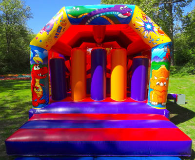 Dinosaur Obstacle Disco, a assault course for hire from Jumping Jacks Bouncy Castles