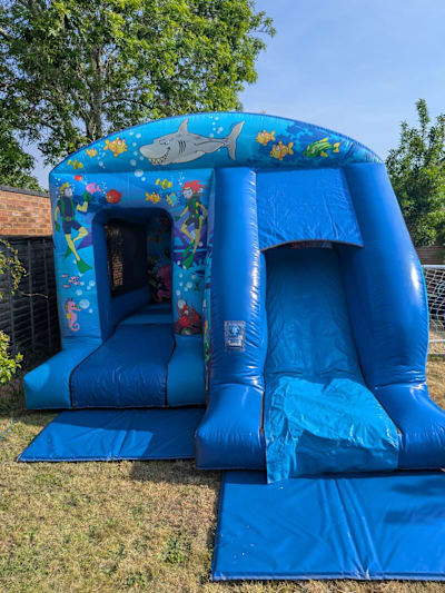 Ocean Bounce 'n' Slide (12ft x 18ft), a bounce and slide combo for hire from Elmbridge Inflatables