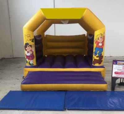 Purple and Yellow Bouncy Castle, a bouncy castle for hire from Happy Days Bouncy Castles