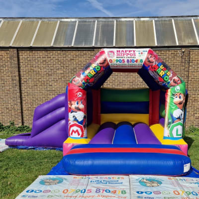 Super Mario Slide 15ft x 18ft - Purple & Red, a inflatable slide for hire from Happy Hippos Bouncy Castles