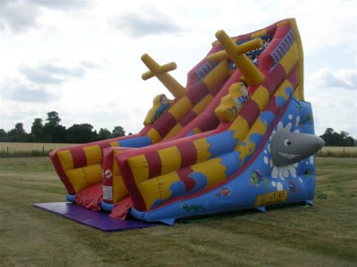 18ft Shark Attack Giant Slide, a inflatable slide for hire from Jump & Bounce