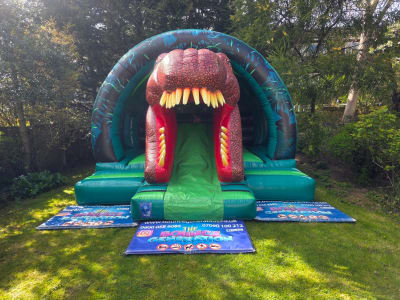 3D Dinosaur Bouncy Castle with Slide, a bounce and slide combo for hire from The Bounce Generation