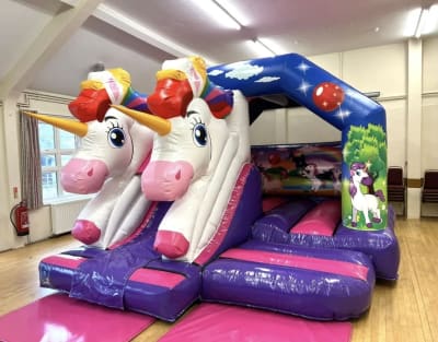 3D Unicorn castle with Slide, a bounce and slide combo for hire from Wazoggies Bounce House