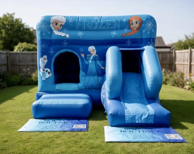 Frozen bouncy castle front slide combo 12x17ft, a bounce and slide combo for hire from The Bounce Boutique