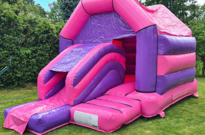 Pink and Purple Castle Slide Combo, a bounce and slide combo for hire from Bouncy Boss