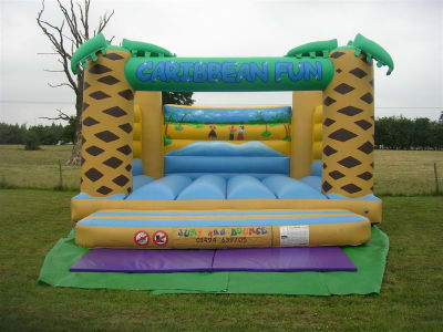 Adult Caribbean Fun Bouncy Castle, a adult bouncy castle for hire from Jump & Bounce