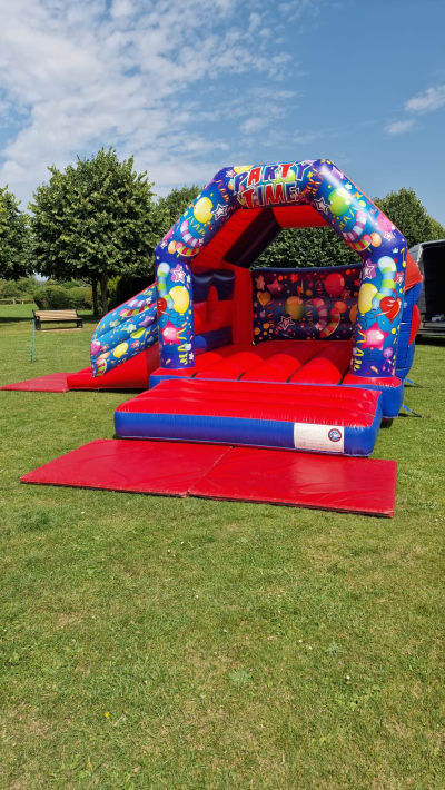 Party Time Bouncy Castle & Slide Combo (15x17ft Red & Blue), a bounce and slide combo for hire from The Bounce Generation