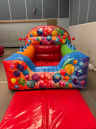 Rainbow Party Inflatable Ball Pit, a soft play set for hire from Elmbridge Inflatables