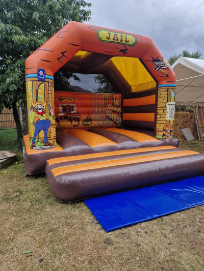 Adult Wild West Bouncy Castle (15x15ft), a adult bouncy castle for hire from Airscape Events