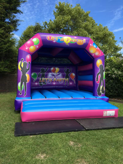15ft x 16ft Adult ‘Lets Party’ Bouncy Castle, a adult bouncy castle for hire from Rick's Castles