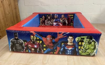 Superheroes ball pit, a soft play set for hire from Wallington Bouncy Castles