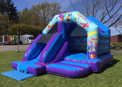 Slide Bouncer Bouncy Castle Party themed with Front Slide, a bounce and slide combo for hire from 1st Choice Inflatables