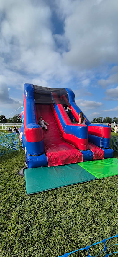 10ft Blue/Red Party Time Platform Slide, a inflatable slide for hire from Every Bounce Counts