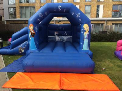 17ft x 15ft Frozen Slide bouncy castle, a bounce and slide combo for hire from TFG Bouncy Castles