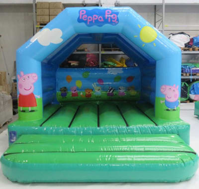 Peppa pig castle, a bouncy castle for hire from Bounce About Sussex