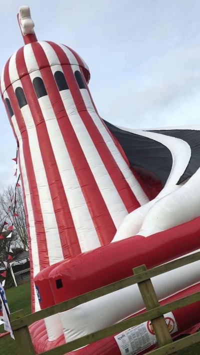 Helter Skelter Mega Slide 10ft Platform, a inflatable slide for hire from Animal Bouncers