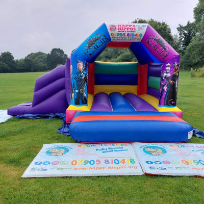 Fortnite Slide 15ft x 18ft - Purple & Red, a inflatable slide for hire from Happy Hippos Bouncy Castles