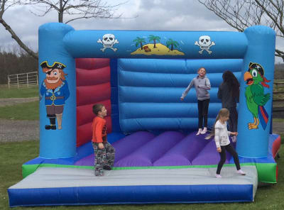 Adult Bouncy Castle Pirate themed 15ft x 15ft, a adult bouncy castle for hire from 1st Choice Inflatables