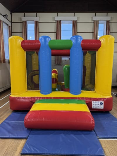 Low Height Multicoloured Activity Bouncy Castle, a bouncy castle for hire from Bounce N Fun